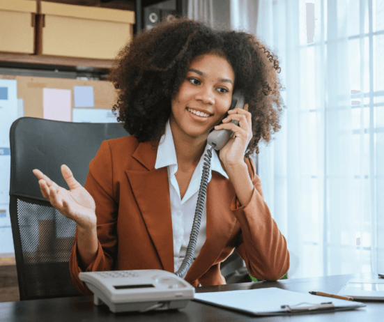 confident Black women on phone; salary negotiation 