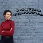 a beautiful Black woman in a red sweater; overcome perfectionism; build resilience, confidence