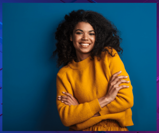 a woman with curly hair smiling; Imposter-Syndrome-Coaching-for-Black-Women