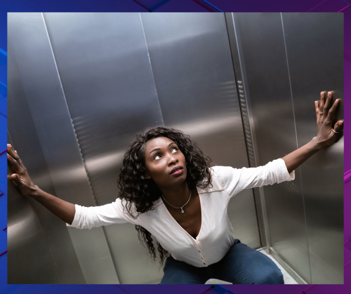 a woman squatting in an elevator; imposter syndrome trap and isolation in the workplace for Black women, Coaching for imposter syndrome