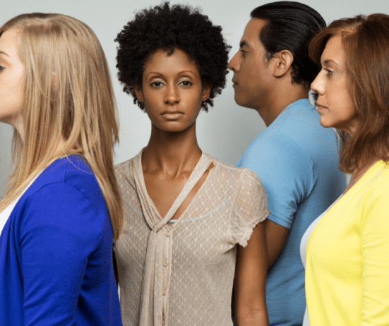 Lonely-woman-standing-in-a-crowd-isolation-Black-women; Career coaching for Black women in senior roles; Coaching services for Black women professionals

