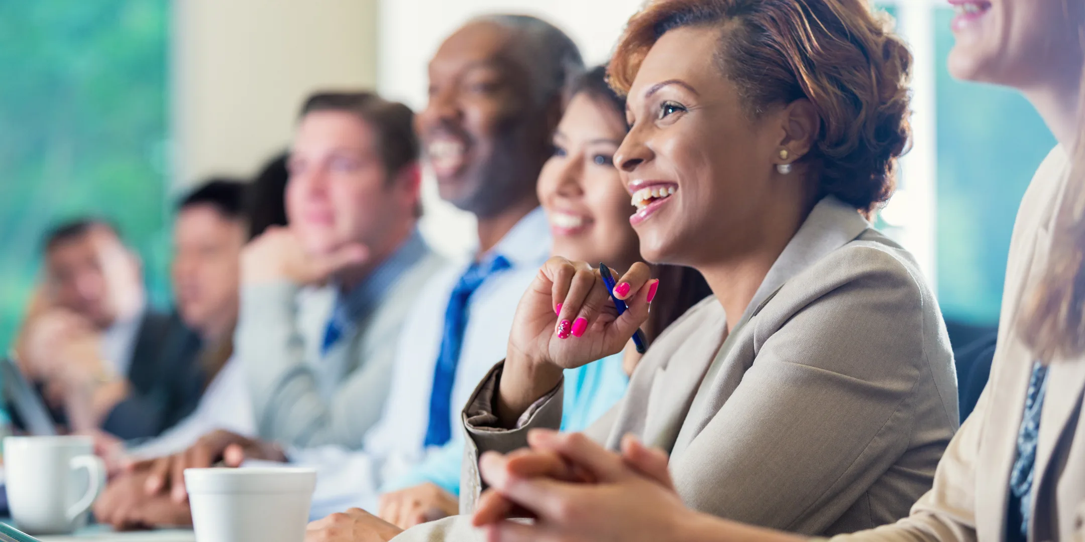 African American businesswoman attending seminar or job training business conference; Leverage Your Transferable Skills for a Career Transition – Learn How to Pivot Without Starting Over ; find Black executive coach near; best Black executive coach near; find Black career near; best Black career coach near 