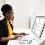 African American manager reading a resume; These 9 Transferable Skills Resources; Black executive coach Twanna Carter; find Black executive coach; transferrable skills; career pivot; career transition; best Black career coach near; how to pivot career; doubt about career change