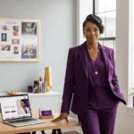 successful Black woman executive standing next to a desk; 3 Branding Mistakes that Sabotage Black Women_Twanna Carter; how to recover from a branding mistake as a black female executive, rebranding strategy after a business mistake black women, fixing a weak personal brand as a woman of color in leadership, managing online reputation for black women executives, how to position myself as an industry expert [black woman], overcoming invisibility as a black woman in corporate america; building authority and credibility as a black female leader; branding for black women who want board positions; how to communicate my value as a black woman executive, personal branding for black women seeking c-suite roles,