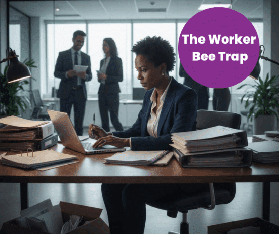 overworked Black woman executive; head down, working; The Worker Bee Trap for Black Women Executives. How Over-performance Keeps Us Invisible in Corporate America; best Black executive near; executive coaching for Black women; find Black executive coach near; award winning Black executive coach Twanna Carter