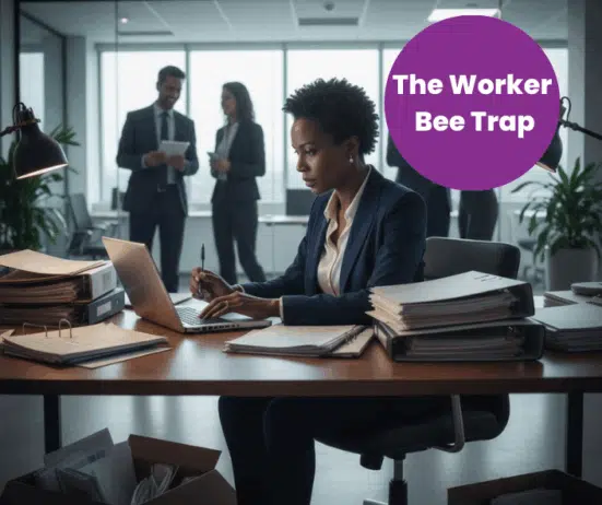 overworked Black woman executive; head down, working; The Worker Bee Trap for Black Women Executives. How Over-performance Keeps Us Invisible in Corporate America; best Black executive near; executive coaching for Black women; find Black executive coach near; award winning Black executive coach Twanna Carter